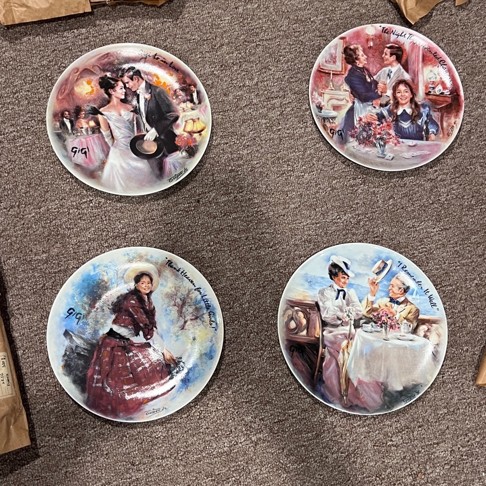 Set of 4 vintage collector plates from the "Gigi" series.